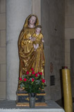 <center>Chapelle Notre-Dame de la Fleur.</center>Vierge à l'Enfant. Derrière, la plaque qui honore la mémoire de l'abbé Pellissier.