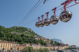 <center>Grenoble. Téléphérique de La Bastille.</center> Le téléphérique de Grenoble Bastille reliant la Bastille au centre de Grenoble est aussi célèbre que le fort. Construit sur l'initiative du maire Paul Mistral, il est inauguré par son successeur Léon Martin en septembre 1934. C'est l'architecte Jean Benoit qui signe les plans des deux gares. La réalisation des travaux est confiée au consortium franco-allemand Bleichert, Neyret-Beylier, Para et Milliat.
