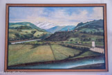 <center>Conflans : Musée d’Art et d’Histoire.</center> Vue d’Albertville depuis Grignon.
Huile sur toile - 1888 - signée J.M. BERTHELON. Albertville compte 4134 habitants en 1881. A cette date, la population de Conflans reste majoritairement tournée vers le monde agricole (346 habitants / 588) ; en bas de la toile, « au centre-ville », domestiques, commerçants et artisans sont fortement représentés.
Cependant, l’endiguement de l'Arly et de l'Isère a permis l'installation de maraichers dans la plaine de Conflans. Ces derniers sont toujours présents aujourd'hui.
Sur le tableau, un vaste bâtiment blanc avec une tour figure au premier plan en bas et à droite. Il s'agit d'une ancienne fonderie, transformée en manufacture de pâtes alimentaires et de semoules. Le bâtiment existe toujours et vous pouvez le découvrir depuis l'esplanade de la Grande Roche, à Conflans.