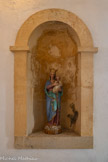 <center>Le château</center>En haut des escaliers, une Vierge à l'Enfant.