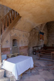 <center>Rochecolombe</center>Au XVIe siècle, on a ajouté une deuxième nef parallèle à la première, voûtée en berceau ; c’est de cette époque que daterait aussi le campanile percé de quatre baies en plein cintre. Enfin, au XIXe siècle, on rajouta encore une nef dotée d’une tribune, orientée cette fois-ci nord-sud, donc perpendiculaire aux précédentes, transformant les deux nefs anciennes en transept. C’est par là que l’on pénètre maintenant dans l’édifice.  L’édifice a donc un plan actuel en “ L ” bien loin du plan originel.
