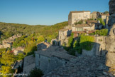 <center>Vue prise du clocher de l'église romane. </center>Le château. Les seigneurs de Balazuc qui régnaient sur le Bas-Vivarais, construisent au XIe siècle un donjon le long du rempart qui entourait le village. Durant les guerres de Religion, les suzerains de Balazuc restent toujours fidèles au roi de France, le village reste catholique au milieu d’une terre alors largement convertie au protestantisme. Les États du Vivarais, scindés depuis 1567 en deux factions, l'une catcatholique et l'autre protestante, signent la paix au château de la Borie de Balazuc en 1576. Le château est ensuite agrandi au XIIIe siècle. À la Révolution française, le comte de Vogüé, dont la famille avait hérité du château, prend la fuite. Le château est alors saisi comme bien national, et vendu à la bougie. Au XIXe siècle, âge d'or du ver à soie alors très exploité en Ardèche, le château de Balazuc devient une magnanerie.