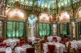 <center>La Fermette Marbeuf . </center> Sa « salle 1900 » de style jardin d'hiver Belle Époque Art nouveau (avec plafond verrière, vitraux, fresques, céramiques, mosaïques, peintures murales, lustres, ameublement, objets de décoration...) est créée en 1898 par le jeune architecte de talent Émile Hurtré (avec les artisans d'art Hubert et Martineau et le céramiste Jules Wielhorski). C'était la salle à manger de l'hôtel Langham, rue Boccador.
