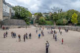 <center>Les arènes de Lutèce. </center> Entre 1860 et 1869, l'ouverture de la rue Monge permit à Théodore Vacquer de mettre au jour et relever les premières traces de la partie nord des arènes. Elles furent réellement dégagées dans leur partie sud par les travaux de terrassement de la Compagnie générale des omnibus entre 1883 et 1885, qui souhaitait construire un dépôt de tramways. Le 27 juillet 1883, Hugo adressa une lettre au président du conseil municipal de Paris pour défendre les arènes de Lutèce, menacées de destruction. Les gradins pouvaient recevoir 17 000 spectateurs.