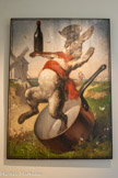 <center>Musée de Montmartre</center>ANDRÉ GILL (1840 -1885)
Enseigne du Lapin Agile, 1875-1880
Huile sur bois
Collection Yves Mathieu, dépôt au Musée de Montmartre. <br>
En 1875, le caricaturiste André Gill doit peindre une enseigne pour le « Cabaret des Assassins » : ce sera un lapin avec casquette et écharpe, sautant d’une casserole avec sa bouteille de vin, devant un moulin et un couple qui s’enlace. Tout Montmartre est là : on appellera bientôt le bar du nom de son enseigne, le « lapin à Gill », se changeant naturellement en « Lapin Agile ». En 1903, le « père Frédé » en devient l’animateur. Avec sa barbe, sa pipe, sa guitare et son âne Lolo, il accueille sans façon la bohème montmartroise des Picasso, Valadon, Utrillo ou Poulbot.