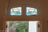 <center>Chapelle Saint-Lucien.</center>Vitraux au-dessus de l'entrée. Les vitraux sont dus à Marguerite Allar (1899-1974) ?