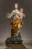 <center>La crypte</center>Vierge au bouquet offerte au sanctuaire par Joseph-Elie Escaramagne.
