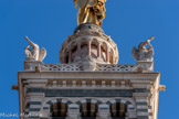 <center>La Vierge, vue de la montée des oratoires.</center>Le clocher se termine par une terrasse carrée bordée d'une balustrade de pierre ajourée comportant au centre de chaque côté les armes de la ville et à chacun de ses angles une statue d'ange sonnant de la trompette. Ces quatre statues ont été sculptées par Lequesne.