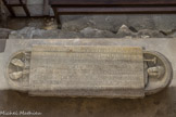 <center>Dalle Funéraire de l'abbé Isarn</center>Le texte authentique est annoncé par un chrisme combiné avec le symbole de la croix; il peut se traduire ainsi : 