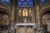<center>Église Saint-Germain-l'Auxerrois.</center>La chapelle du Tombeau. La chapelle est peinte et décorée à l’antique par Auguste Couder (1844) et ses vitraux, signés par Étienne Thevenot (1840), s'inspirent de ceux de la Sainte-Chapelle. L’autel de style Louis XVI date de 1840. En pierre de Conflans, il comprend un Christ gisant dont l'origine est incertaine, peut-être un reste d’un ensemble de l’École française du XVIe siècle repris par Fouginet au XIXe siècle. Au-dessus, une crucifixion entourée des allégories de l'Egilse et de la Synagogue.