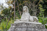 <center>Parc de Bagatelle. </center> Un des deux sphinx d'une des terrasses latérales qui sont des moulages conçus pour réaliser un ensemble symétrique. Ceux devant le trianon portent une plaque expliquant que cette paire de sphinx a été commandée à Lhuillier en 1778 par Bélanger, architecte du conte d'Artois, pour le perron du château de Bagatelle, et que Lhuillier en sous-traita la sculpture à Phillippe-Laurent ROLAND (1746-1816). Ils furent livrés en 1781.