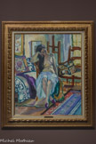<center>Henri Manguin (1874 -1949)</center>Nu dans un intérieur. 1905.
Huile sur toile <br>
Ce nu se situe dans l'atelier du peintre. L'artiste a créé une véritable mise en scène de motifs en multipliant les tissus, tapis, couvertures et coussins afin de faire dialoguer les lignes du corps et du décor. Une lumière douce, filtrée par les voilages de la fenêtre, harmonise la composition dans une atmosphère vaporeuse. Nous sommes en 1905, l'année du Salon d'automne ou le fauvisme fait scandale. La même année, Manguin travaille à Saint-Tropez.
À cette époque, le Midi de la France est le berceau de la modernité en peinture et accueille de nombreux peintres venus se confronter à la puissance de la lumière et des couleurs.