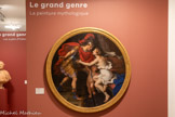 <center></center>Le grand genre utilise une rhétorique visuelle, permettant d'assimiler la peinture à un discours efficace et bien lié. L'histoire des sujets est lisible à travers les corps et les visages des personnages, d'où le soin extrême apporté aux attitudes et aux gestes, au jeu des physionomies et aux accessoires. La réalité n'est copiée que pour être dépassée et transposée dans de nobles compositions.
Dans la peinture mythologique, l'artiste reprend des sujets et des personnages de la mythologie gréco-romaine, issus des textes littéraires antiques, mais il les interprète avec une grande liberté. La Toilette de Vénus de l'École de Fontainebleau [n°8], audacieuse composition pyramidale de grands nus couronnée de lourds rideaux verts, oscille entre mythologie et allégorie, démonstration et dévoilement, et fascine par l'atmosphère raffinée et précieuse qu'elle dégage. Plus tardif, le Mars et Vénus de Nicolas Mignard [n°9] qui s'inspire des Métamorphoses d'Ovide et dépeint les amours des dieux, témoigne de liens évidents avec l'univers du théâtre.