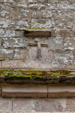 <center>Najac : Église Saint-Jean l’Évangéliste.</center>Sur la façade nord se trouve un portail surmonté d’un christ en croix d’une grande antiquité. Datant du XIe siècle, ce christ provient vraisemblablement de l’ancienne église Saint-Martin.