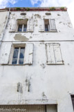 <center>Maison en terre.</center>Sous les rois d'Aragon, l’urbanisation de ce quartier démarra sur le Puig, colline dominant la ville, autour de l'église. Au milieu de ses maisons à un étage, aux murs en terre surélevés par la suite, s'élevèrent cinq grands couvents, des casernes, l’Université et des hôtels particuliers. Les Juifs y vécurent pendant trois siècles dans leur call. Quartier des lépreux, il fut ensuite peuplé de moines, tisserands, jardiniers, militaires et prostituées, artisans et ouvriers dont les célèbres « paperettes » de l'usine JOB. Au 19e siècle, les premiers gitans s'y installèrent et les années 1960 virent l'arrivée des maghrébins.