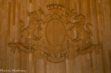 <center>L'hôtel de ville.</center>Armoiries de Marseille. Il est tout à fait possible que la croix marseillaise ait été à l’origine la croix de  l’emblème de l’abbaye avant d’être celui des vaisseaux massaliotes. Le sceau de la commune de Marseille datant de 1243 où Saint-Victor porte la croix sur son bouclier va dans ce sens. Le fond de l'écu (le dessin du blason en forme de bouclier) est blanc et il contient une croix de couleur bleue.
Cette croix est héritée du temps des Croisades. A cette époque, chaque port d’embarquement vers la Terre Sainte arborait sur leurs vaisseaux une croix de couleur différente afin de distinguer les flottes les unes des autres. Or, Marseille était un important port d'embarquement qui fournissait aux Croisés, des vaisseaux, du ravitaillement et des vivres. La couleur bleue fut choisie pour identifier les navires de la ville. Les tenants sont  un taureau armé d'un trident à gauche et un lion armé d'un caducée à droite. Le caducée est le symbole du commerce, le trident celui de la mer : le tout représente les échanges commerciaux par voie maritime. Le lion et le taureau sont des symboles empruntés aux pièces de monnaie massaliotes. Le taureau symbolise le labeur, l'endurance et le lion la force, le rayonnement. La devise 