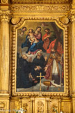 <center>L'église Saint-Trophime-Saint-André</center>Vierge à l'Enfant, saint André, saint Antoine le Grand, un abbé à la calotte crânienne tranchée, un évêque tête nue (Saint Trophime), la mitre posée sur le sol. En bas, à droite, des armoiries : au centre d'un rosaire de fer, écu d'or à un arbre de sinople surmonté d'une croix d'argent accosté de croissants de gueules.