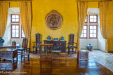 <center>Château de Lourmarin</center>La Sallestre. La salle de réception où les seigneurs passaient beaucoup de temps.
Dans cette salle, ils recevaient leurs amis et dansaient...
La plupart des meubles sont espagnols. Sur le mur, le médaillon des Trois Grâces (déesses grecques). Sur la table, Meuble de présentation .  19éme siècle, France, noyer. Ensemble de meubles que l’ébéniste présentait à ses clients pour montrer ce qu’il pouvait réaliser, généralement du plus simple au plus élaboré du point de vue des bois et de la décoration. Au centre, une balance à trébuchet.
